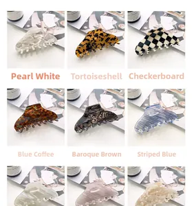 Collage of large acetate hair claws in pearl white, tortoise shell and checkered patterns