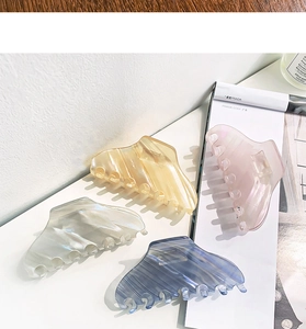 Set of four large acetate hair claws with premium marble patterns and pearlescent finish