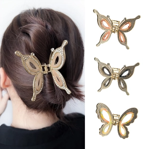 Elegant metal butterfly hair claw clip with rhinestones and translucent resin wings