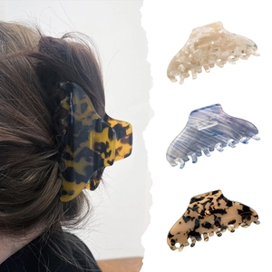 Large tortoiseshell acetate claw clips in four patterns for thick hair styling