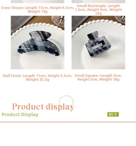 Detail of four acetate hair claws with marble texture and rhinestones in various shapes