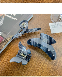 Three-piece set of grey marble acetate hair claws with sparkling rhinestone accents