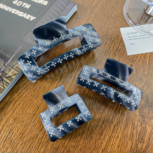 Three-piece set of dark blue marble cellulose acetate hair claws with sparkling rhinestones