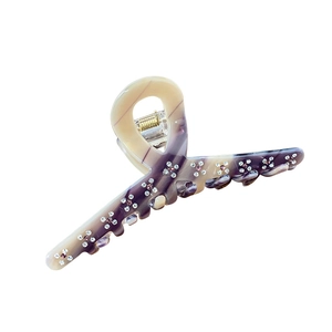 Pince à cheveux élégante en acétate marbré avec strass violets et ressort doré robuste