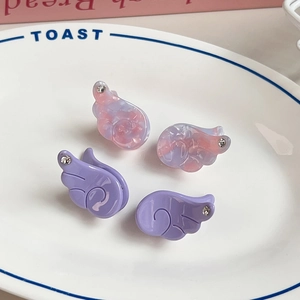 Sweet angel wing hair clips in purple marble acetate with sparkling rhinestone details