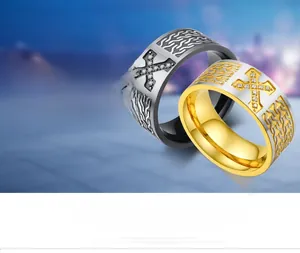 Detail of 18K gold plated cross rings with paved stones and chain texture accents