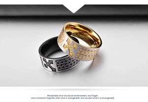 Detail of 18K gold and silver cross rings with diamond accents and geometric engraving