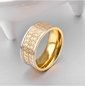 Two-tone stainless steel wide ring with engraved gold chain pattern and polished silver edges