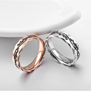 Polished vine-textured couple rings in rose gold and silver with faceted edges