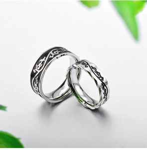 Retro stainless steel vine pattern couple rings with polished finish and black totem design