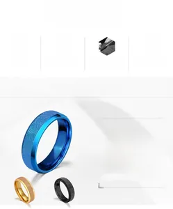 Three 6mm matte titanium steel rings in blue, gold, and black with a sandblasted finish