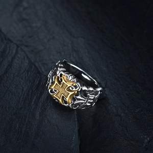 Vintage stainless steel cross ring for men with gold accents and embossed patterns