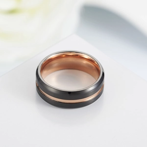 Men's two-tone ring with black brushed surface and rose gold inner band in minimalist style