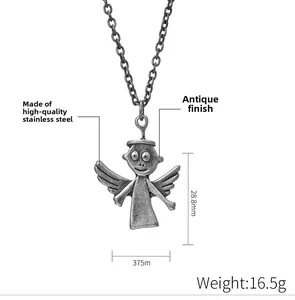 Detail of vintage stainless steel angel pendant with old craft texture and halo