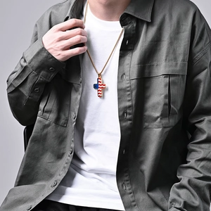 Gold stainless steel cross necklace with American flag stars and stripes on male model