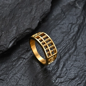 Men's 18K gold plated titanium abacus ring with ancient coin pattern on black rock