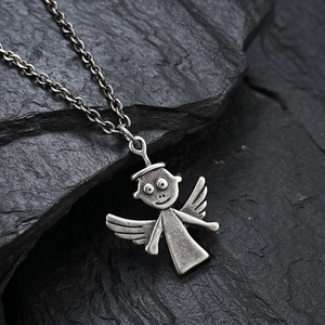 Retro angel pendant necklace in vintage titanium steel on a textured black rock background