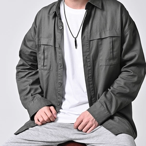Men's dark gray cargo shirt jacket with a stainless steel bullet pendant necklace