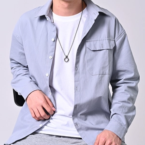 Men's double ring stainless steel necklace on model wearing a purple casual shirt