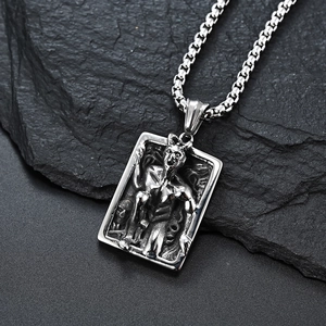 Gothic demon relief rectangle pendant in vintage silver stainless steel on dark rock