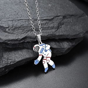 Colorful astronaut pendant necklace with silver stainless steel chain on black rock