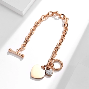 Rose gold heart bracelet with OT clasp and sparkling crystal charm on white background
