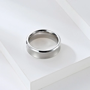 Macro shot of minimalist silver ring with polished inner surface and brushed metal finish