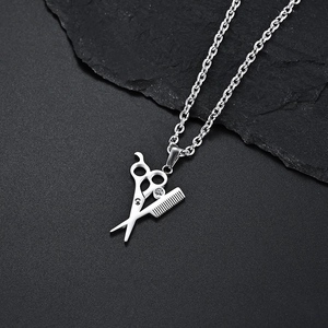 Barber theme silver necklace with scissors and comb pendant featuring a small rhinestone