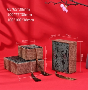Three sizes of vintage linen jewelry boxes with tassels and Chinese calligraphy patterns