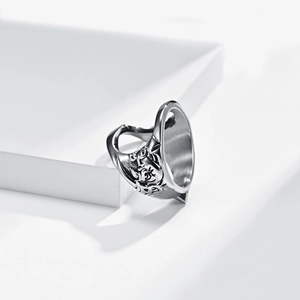 Detailed view of vintage baroque floral embossing on matte silver stainless steel ring