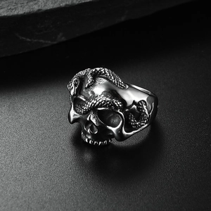 Gothic hip hop ring featuring a detailed skull and serpent design in aged silver finish