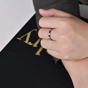 Minimalist silver stainless steel ring with black enamel line for unisex daily wear