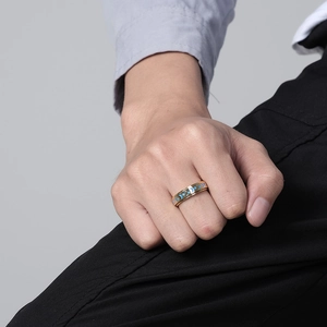 Close-up of golden stainless steel fidget ring with blue star and moon spinning band