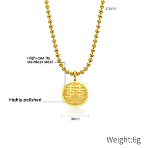 Macro detail of 10mm gold plated stainless steel Xi pendant with ball chain