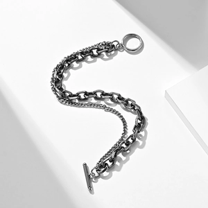 Detail of vintage silver double-layer chain bracelet with industrial T-bar OT closure