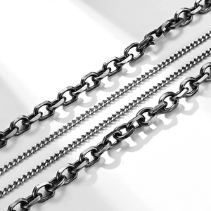 Detail of vintage silver steel chains with oxidized industrial finish and diverse links