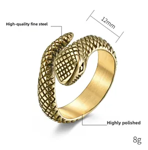 Detailed macro view of gold steel snake ring showing 12mm head width and scale texture