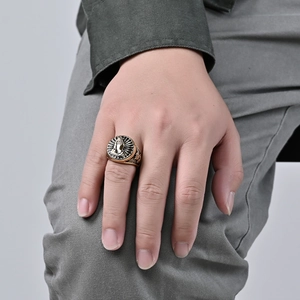Vintage gold stainless steel praying hands ring with an antique finish on male model