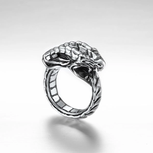 Macro shot of Gothic dragon ring details featuring skeletal textures and oxidized finish