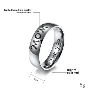 Close-up of 6mm stainless steel ring featuring MOM and I love you laser engravings