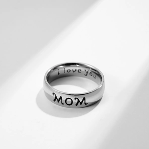 Macro shot of 6mm stainless steel ring with MOM and I Love You laser engraving