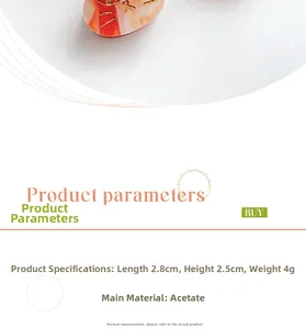 Detail view of acetate cat hair clip with orange marble pattern measuring 2.8cm by 2.5cm