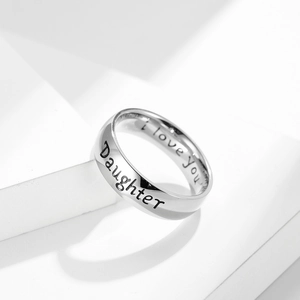 Macro shot of 6mm stainless steel ring with Daughter and I love you engraving