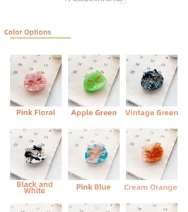 Detailed color selection of cute cat-shaped resin hair clips with marble texture