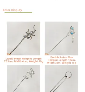 Detailed view of silver metal hair sticks with blue floral tassels and lotus designs