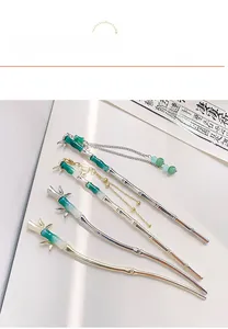 Detailed close-up of Chinese style bamboo joint hairpins with tassels and beads