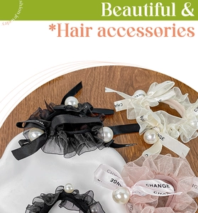 Detail of elegant cream scrunchie with CHANGE silk ribbon and 12mm white pearl charm