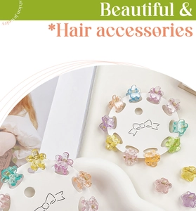 Set of 10 mini flower hair claw clips in colorful glittery jelly tones on a card