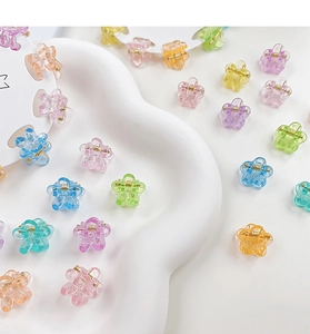Macro shot of 10pcs mini flower hair claws with glitter in macaroon colors