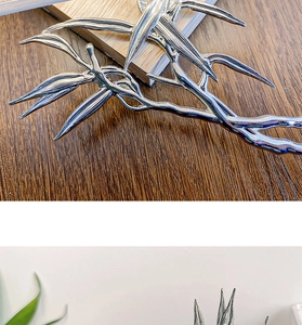 Detailed close-up showing the silver bamboo leaf hair pin with realistic metallic texture